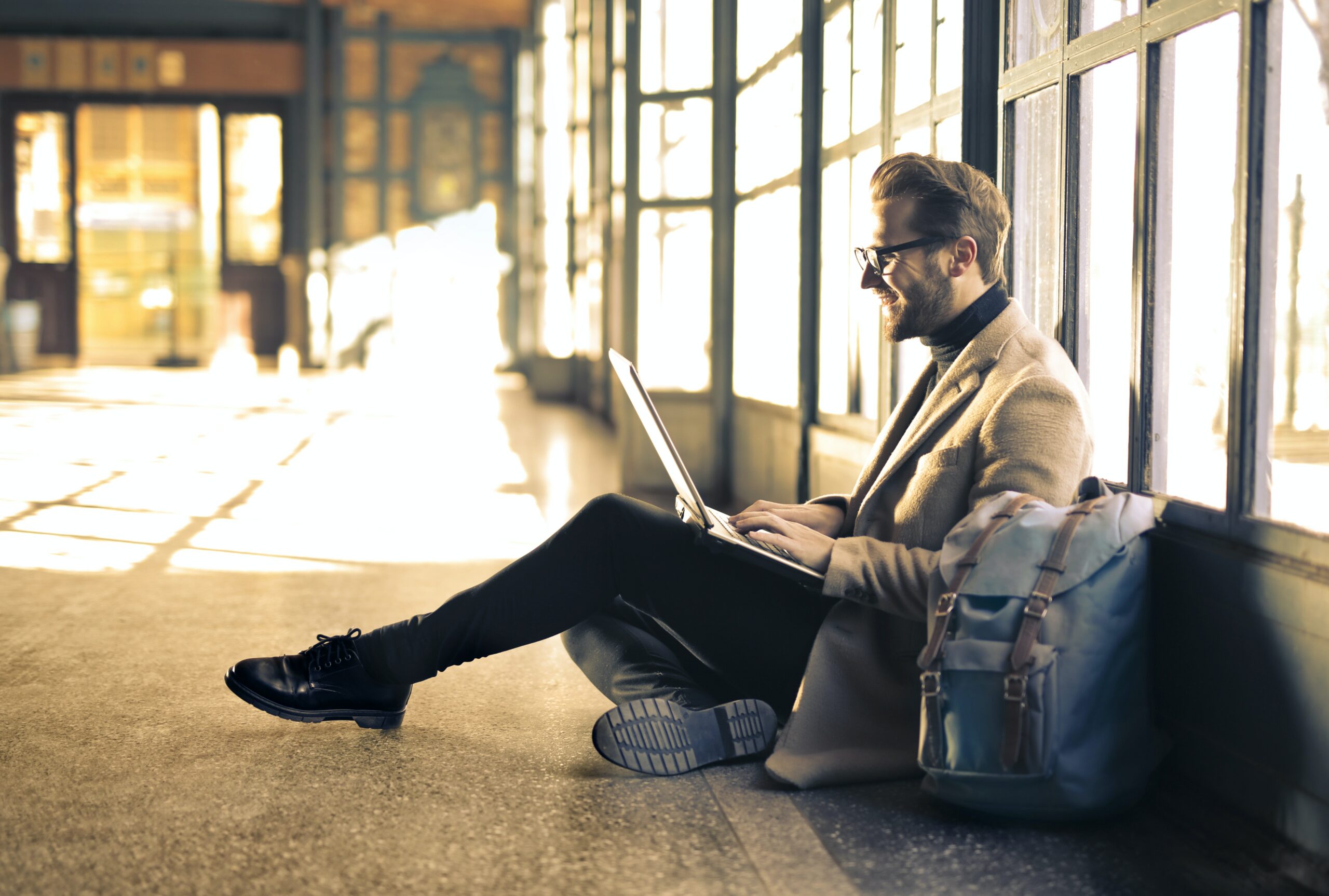 Man with a laptop on the floor